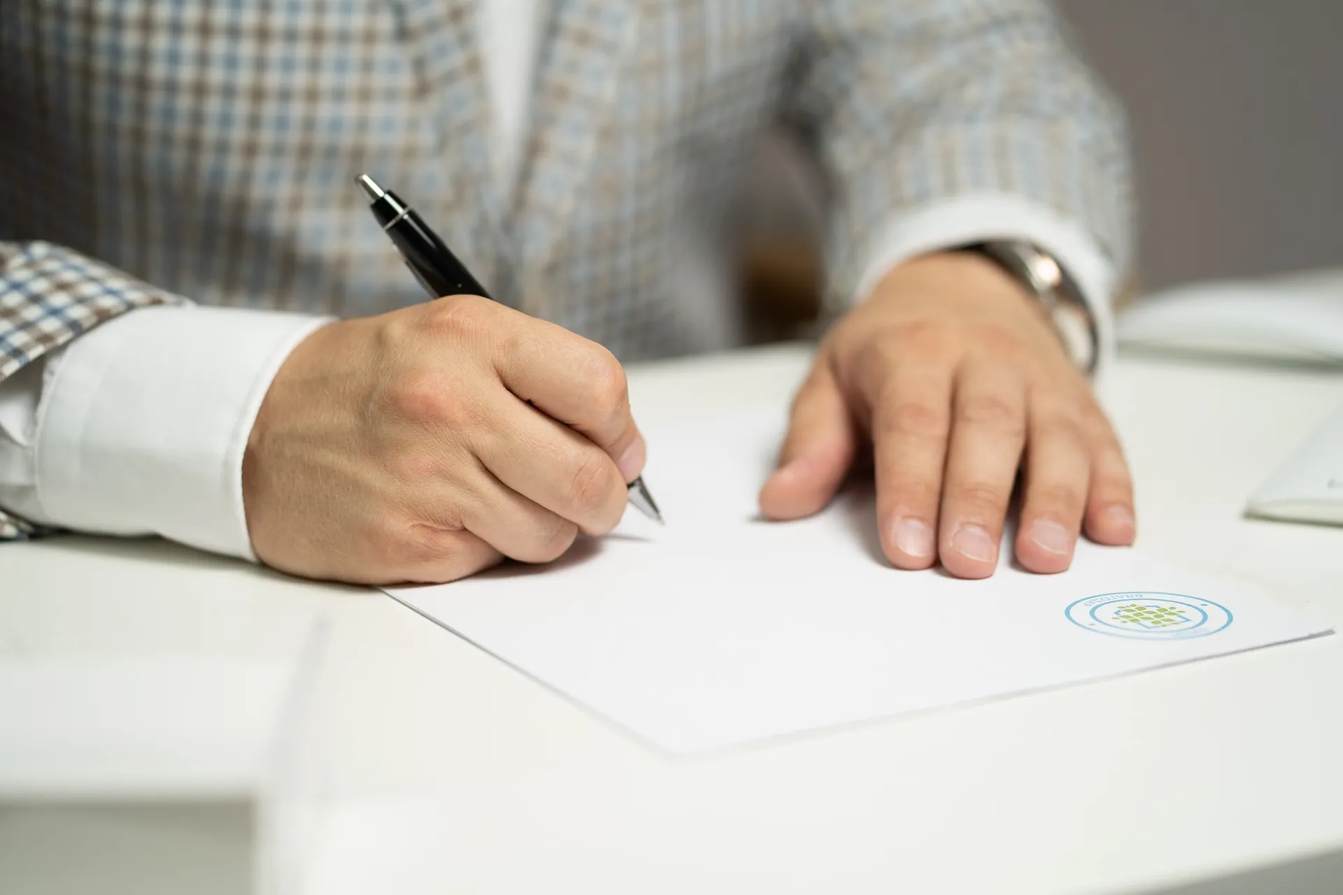 Man writing domestic contract KPA Lawyers
