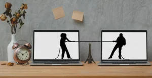 tug of war silhouette on laptops separation agreement KPA Lawyers